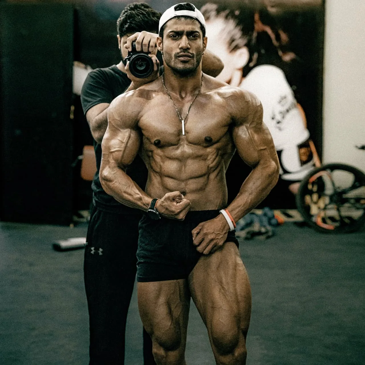 Zohaib Alam posing backstage while being photographed